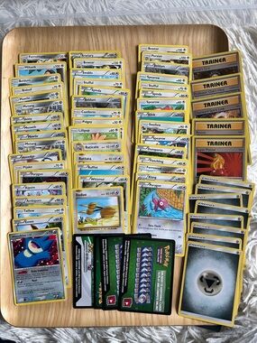 65 Grey/silver Lot of Pokémon Playing and Trading Cards, trainers, energy, onlin